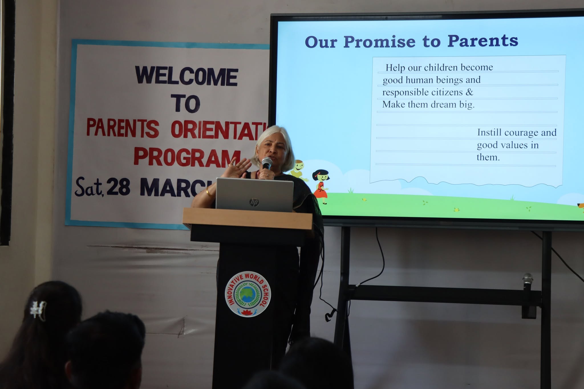 Parents listening at an Innovative World School Parent Teacher Meeting