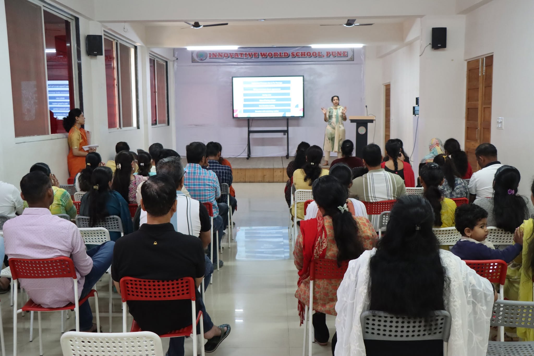 IWS faculty and management addressing a parent meeting